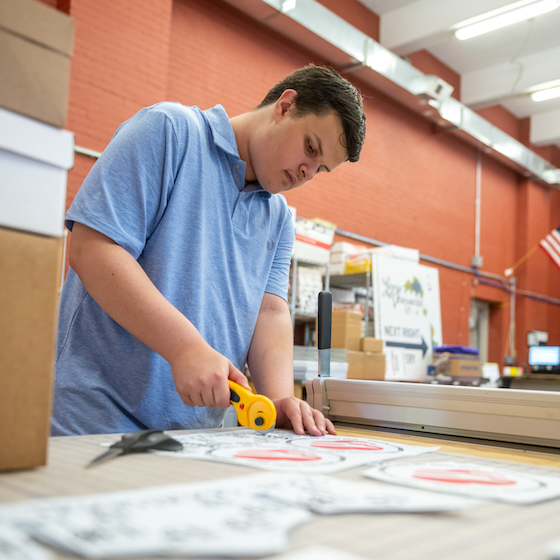 Antonio Vasquez works at the print shop at Hood.