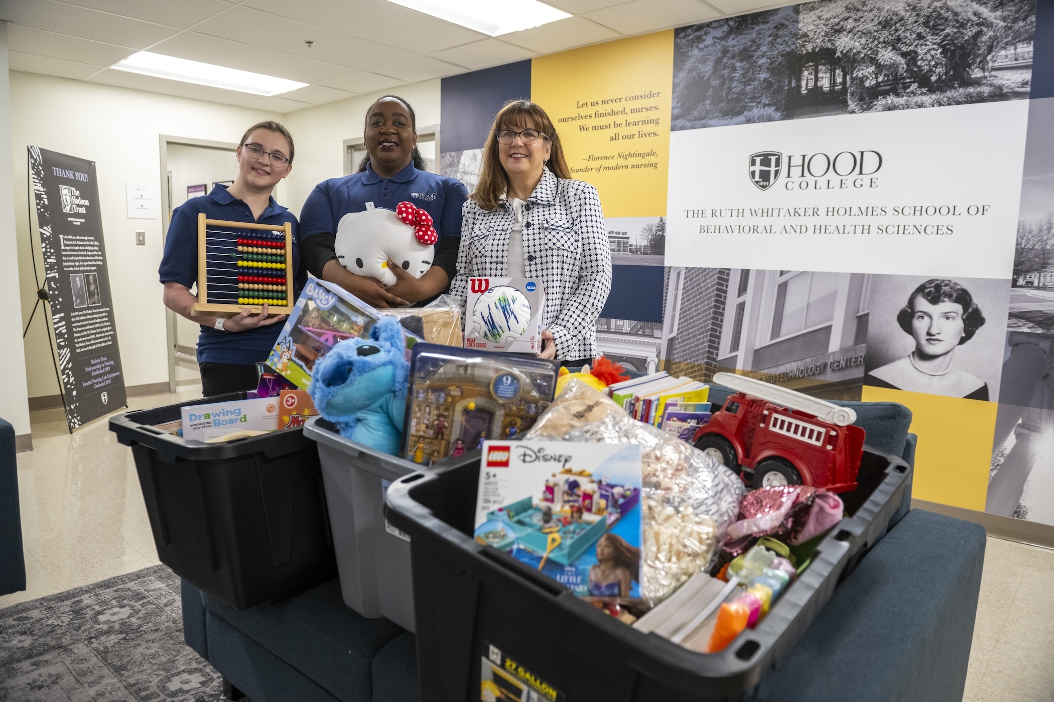 Members of the nursing club pose with donated toys.