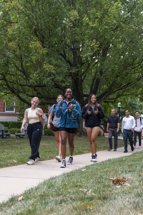 Students and faculty walking by Shriner Hall