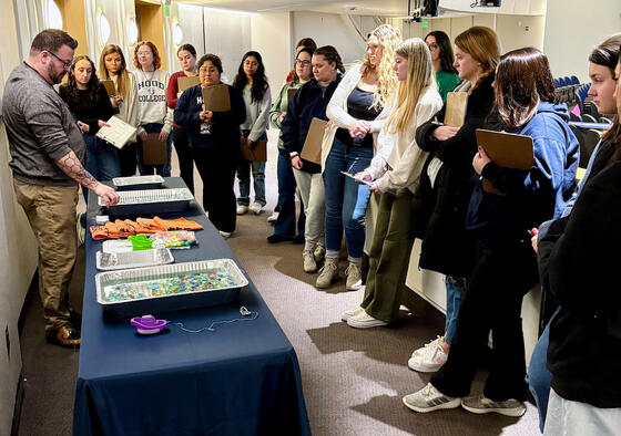 Hood students watching a demonstration at the Naval STEM Academy.