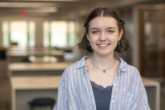 Tamsin Moore standing in the Beneficial-Library and Learning Commons.