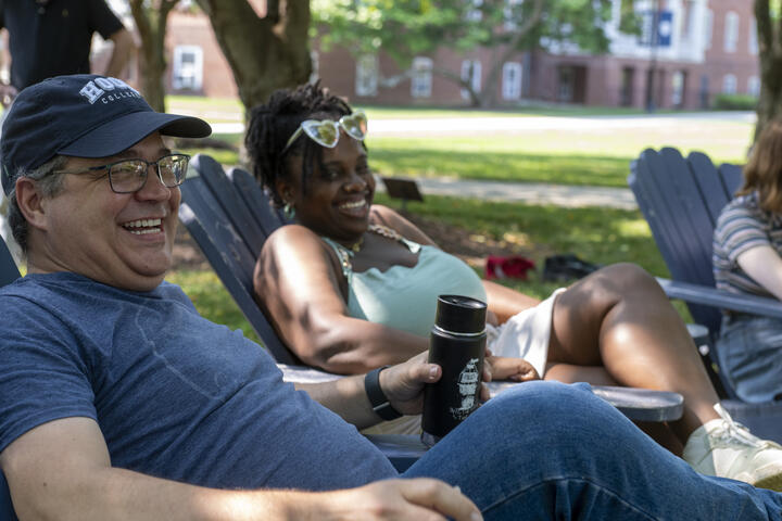 A professor and student during an outdoor workshop.